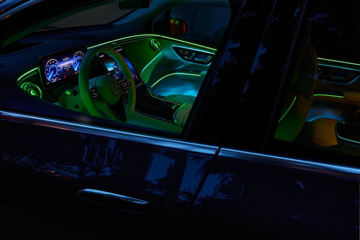 Premium vehicle interior with a large multimedia display screen